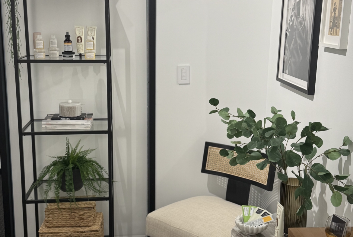Beautiful salon waiting area with plants and artwork for a relaxing client experience.