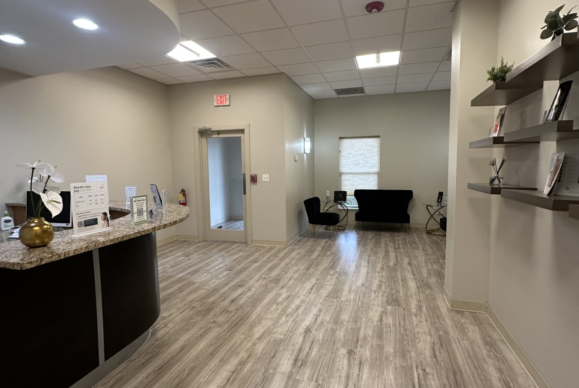 Clean and inviting salon waiting area with comfortable seating and sleek decor.