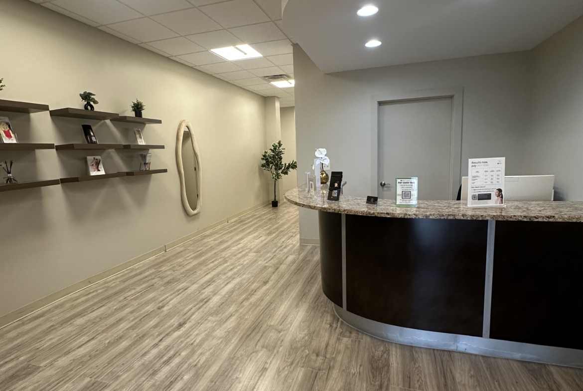 Bright, contemporary salon reception with stylish decor and welcoming check-in counter.