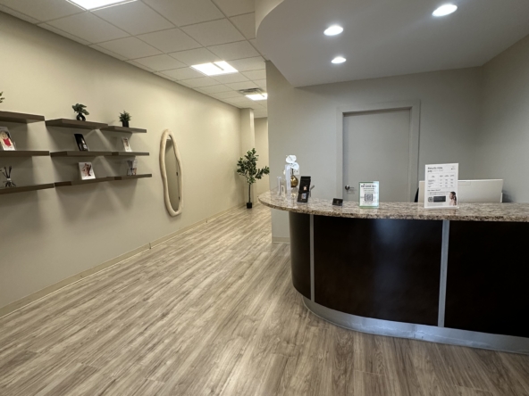 Bright, contemporary salon reception with stylish decor and welcoming check-in counter.