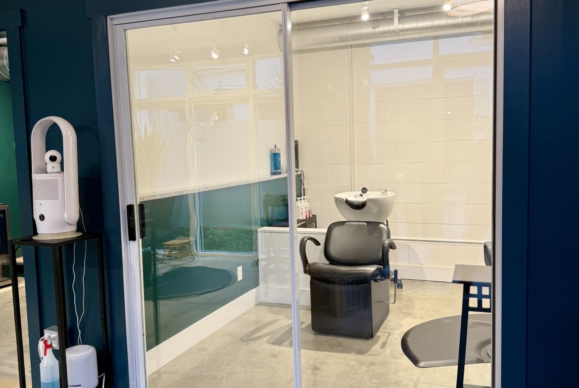 A clean, modern salon rental with private space for hair styling and client comfort.