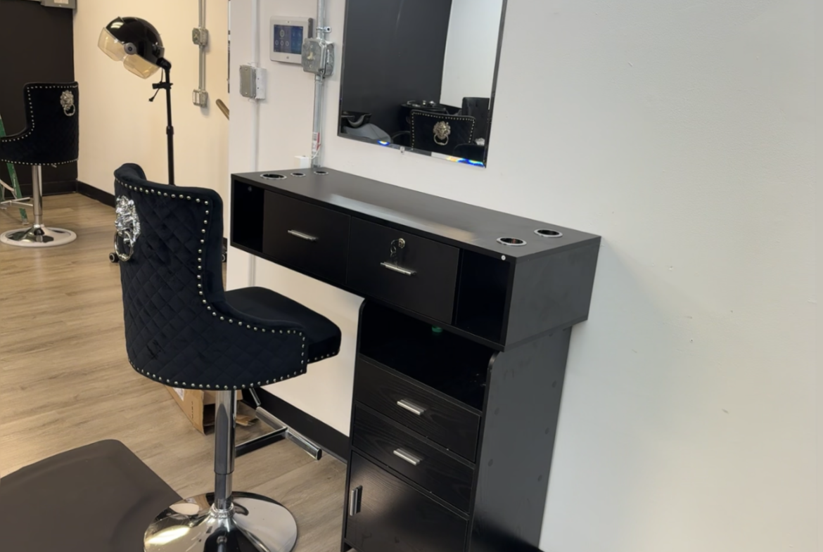 Salon workspace featuring styling chair, mirror, and storage cabinet for professional beauty services.