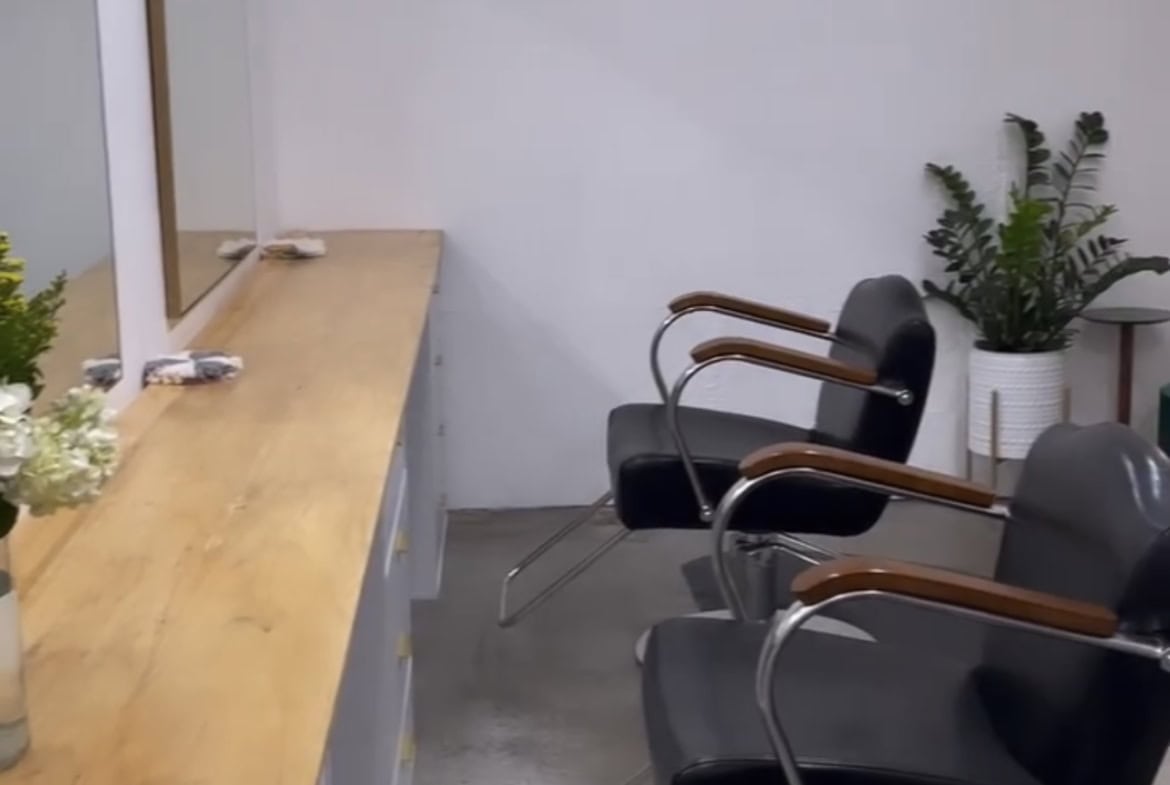 1. Modern salon chairs at Vera Salon with stylish decor and natural lighting.