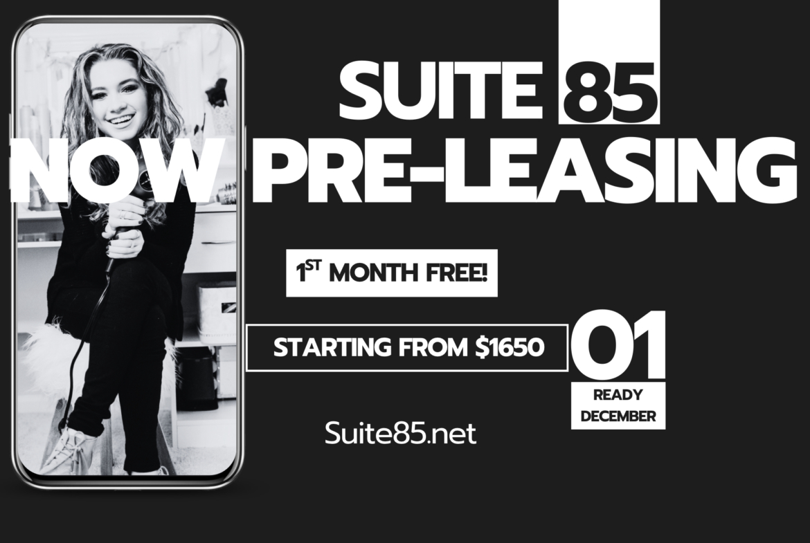 Bright, professional salon interior with young woman styling hair in a welcoming environment.