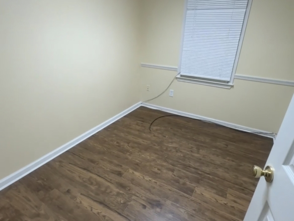 Bright, clean room ideal for salon or beauty business setup with ample natural light.