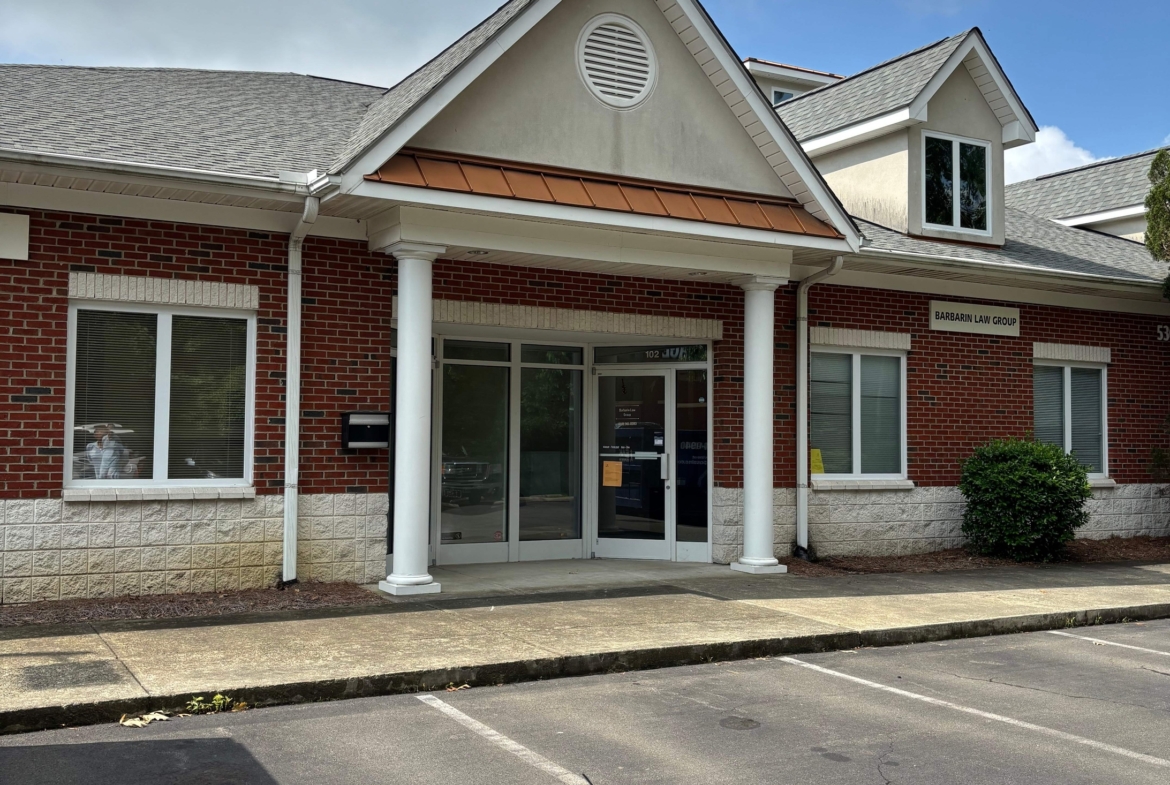 Modern commercial building for salon rental with brick exterior and welcoming entrance.
