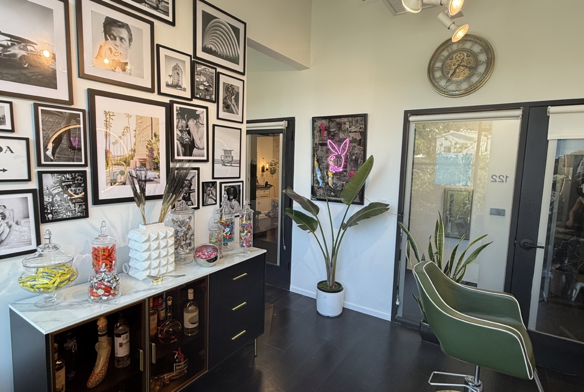 Salon decor with chic wall art and contemporary styling chairs in a trendy hair salon.