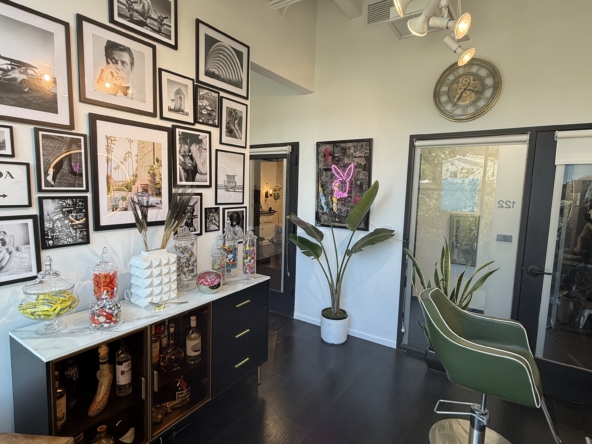 Salon decor with chic wall art and contemporary styling chairs in a trendy hair salon.