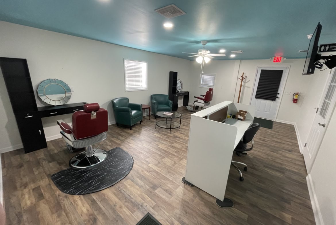 Bright salon waiting area with stylish chairs and modern decor, perfect for clients to relax before appointments.
