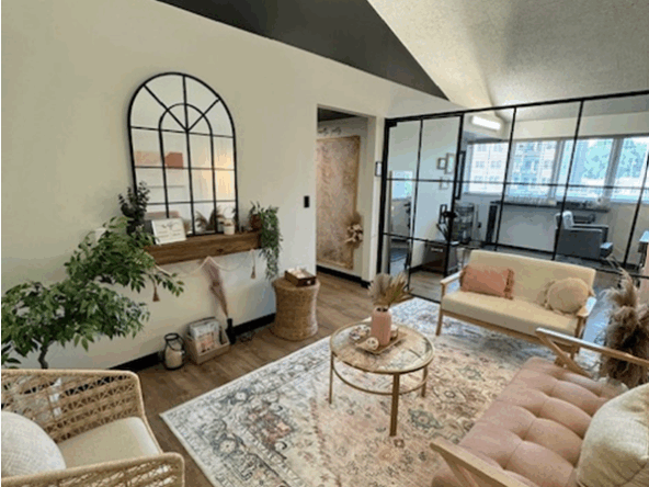 Bright, stylish salon workspace with comfortable seating and ample natural light.