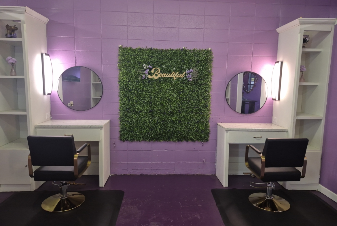 Versatile salon workstation featuring stylish decor, bright lighting, and organized storage space.