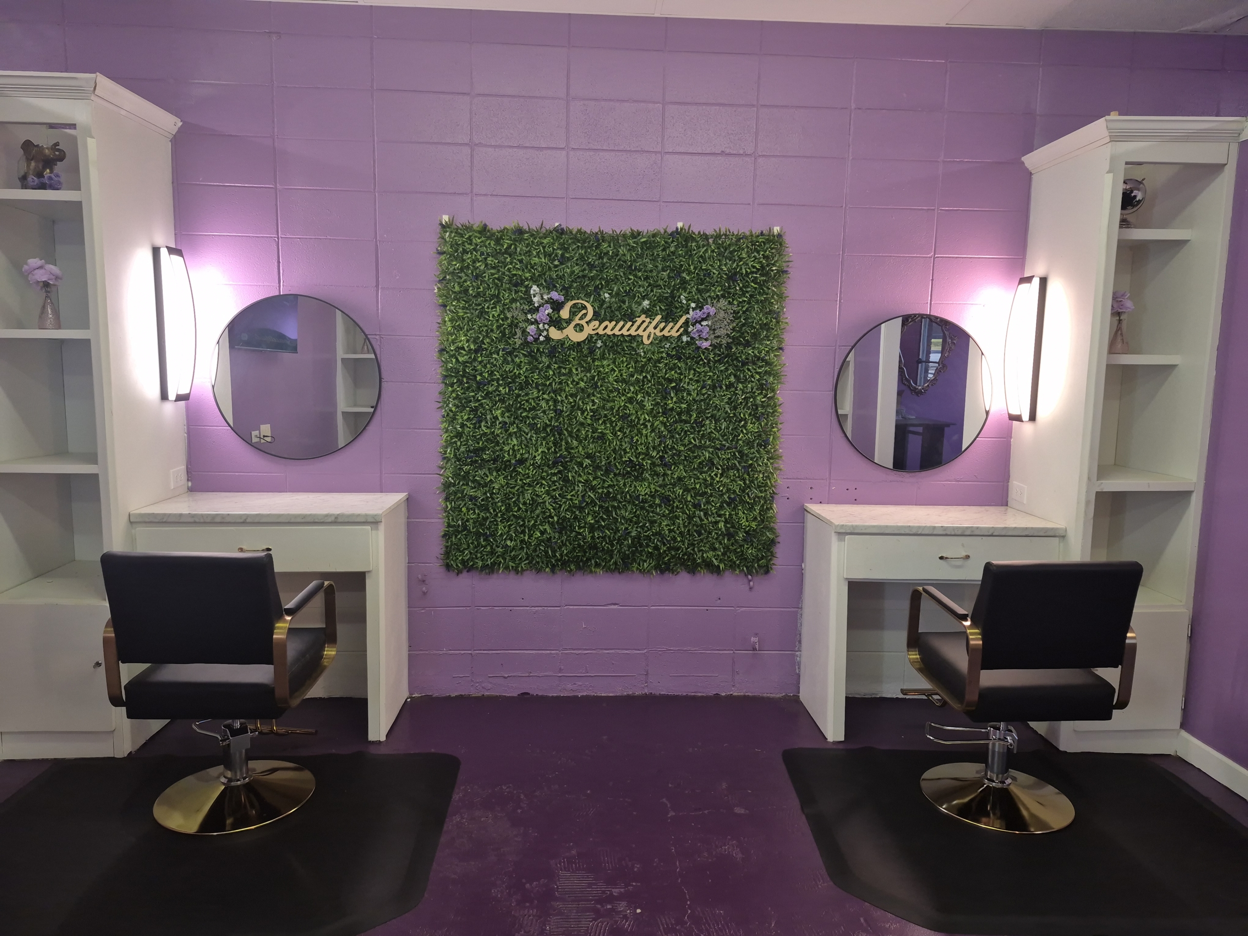 Versatile salon workstation featuring stylish decor, bright lighting, and organized storage space.