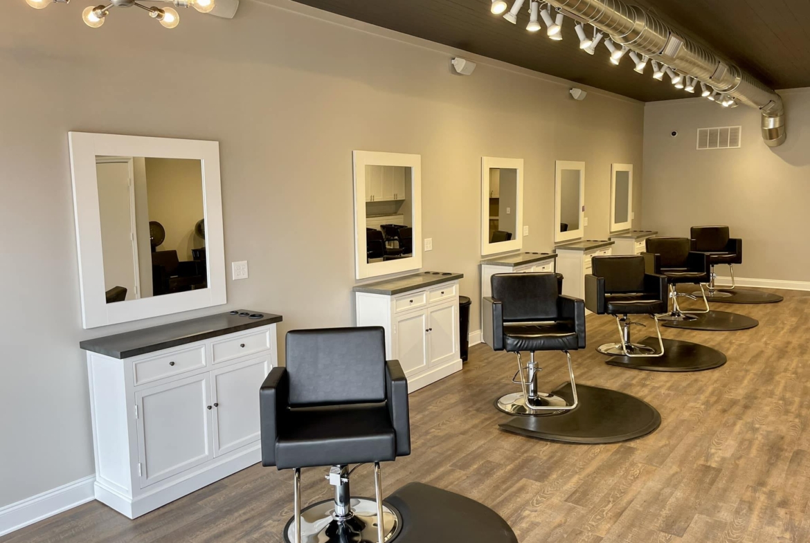Modern salon workspace with styling chairs and mirrors, perfect for rent or salon business.