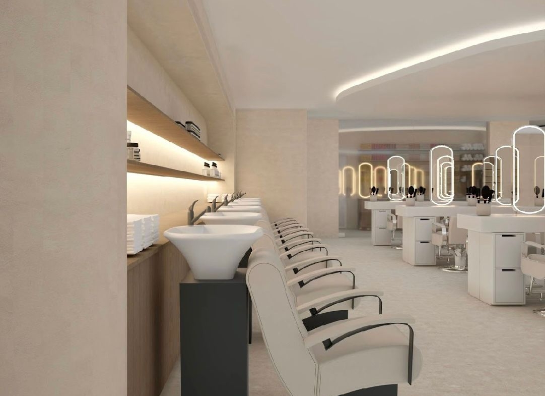 Elegant spa-like salon with chic seating, contemporary lighting, and clean aesthetic.