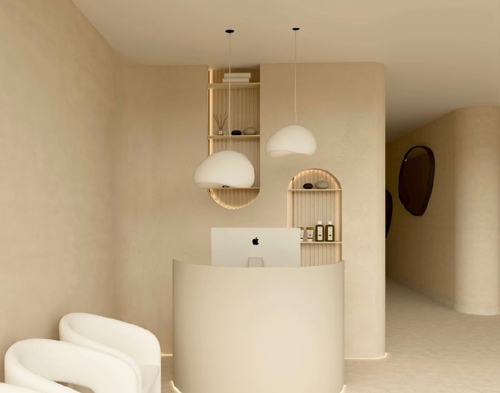 Elegantly designed salon reception with minimalist decor and comfy seating.