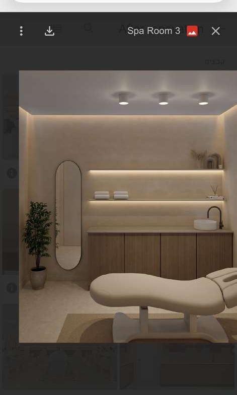 Serene spa room with relaxing treatment bed, minimalist decor, soft lighting, and calming ambiance.