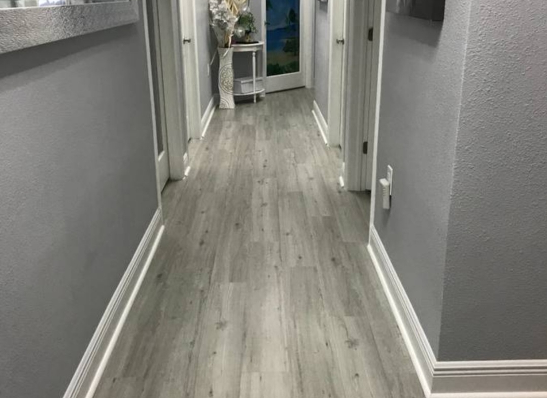 Clean and stylish salon corridor with contemporary decor and artwork | Salon Renter.