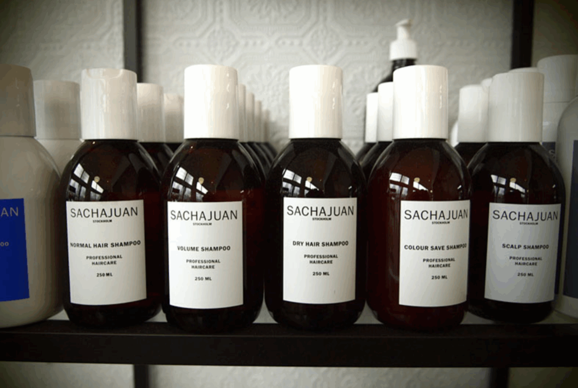 High-quality shampoo bottles on salon shelves, featuring professional haircare brands.