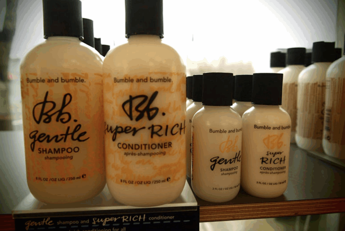 Salon professional shampoo and conditioner bottles display premium hair treatment products.