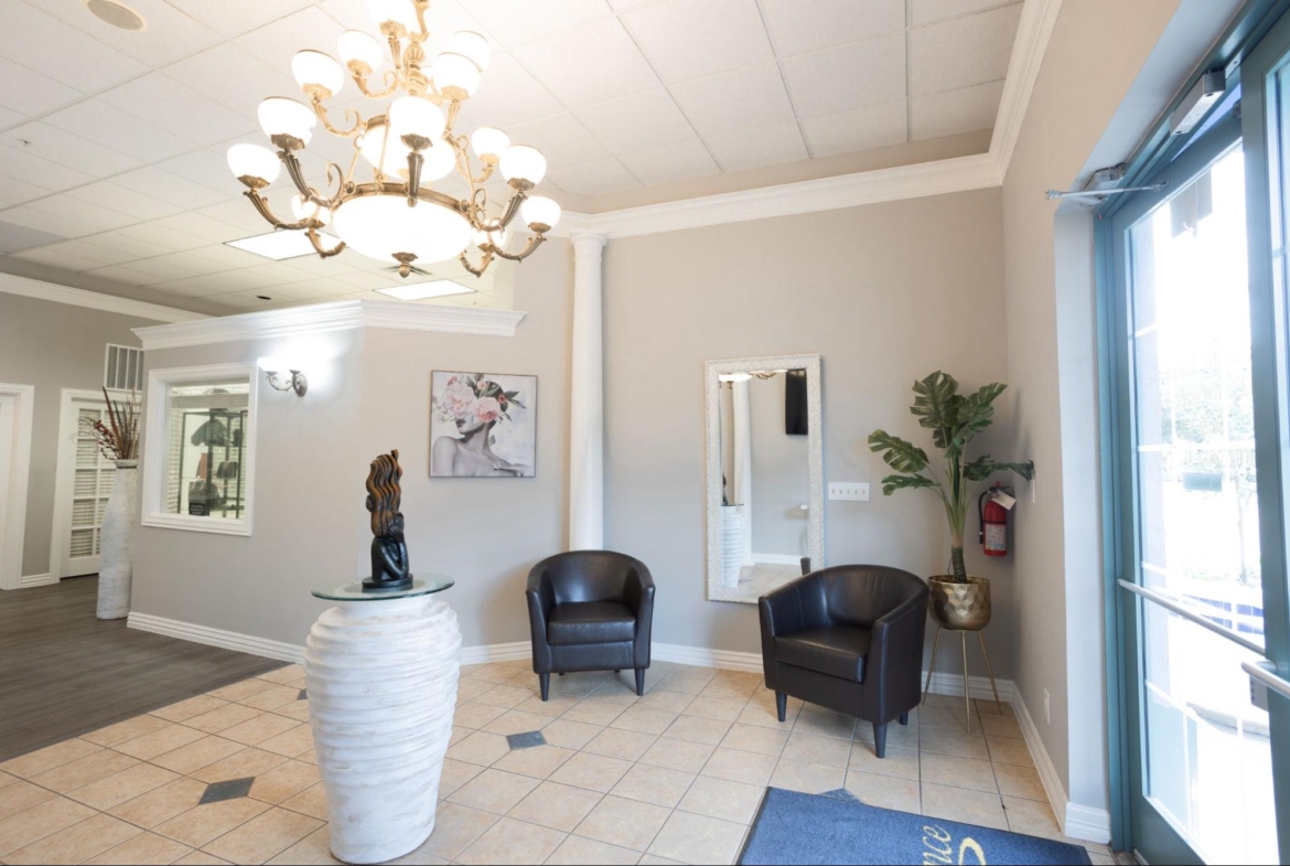 Bright reception area with stylish decor and seating, ideal for salon owners seeking rental spaces.