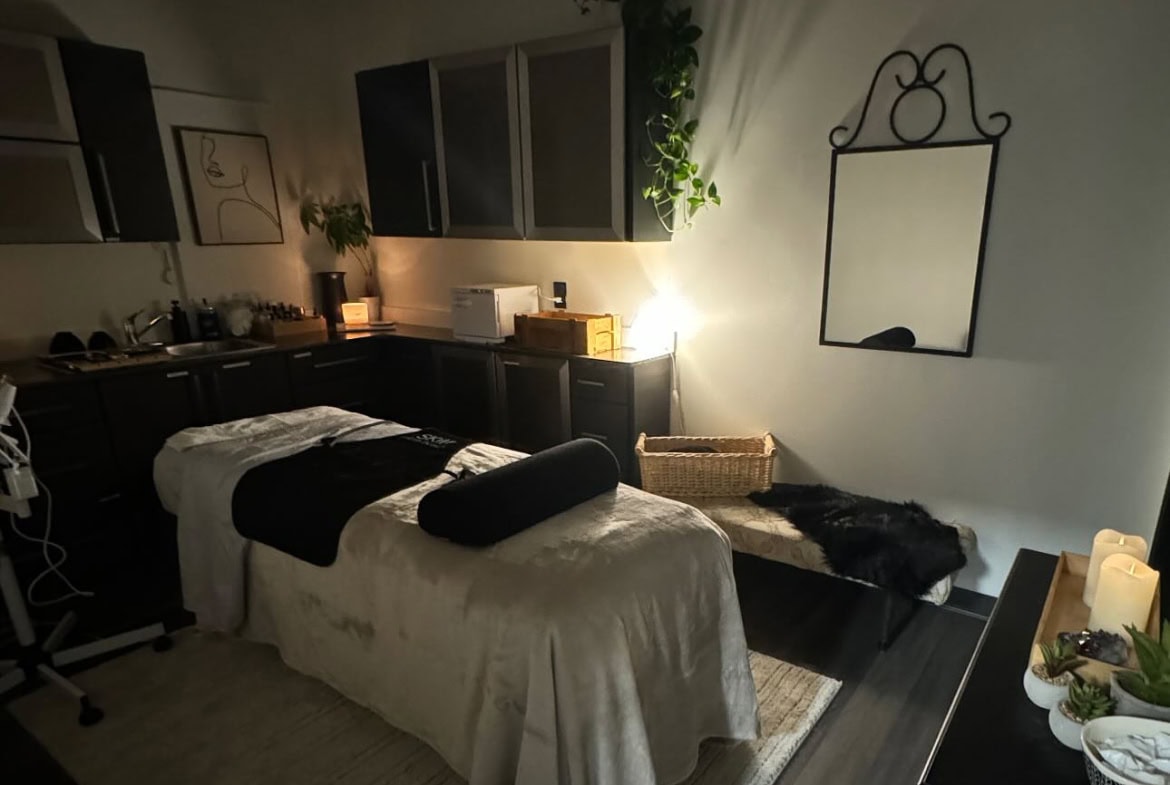 Relaxing massage room with calming ambiance and soft lighting for salon clients.