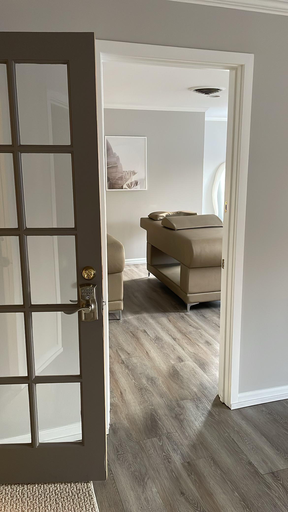 Relaxing massage room with massage table and calming decor.