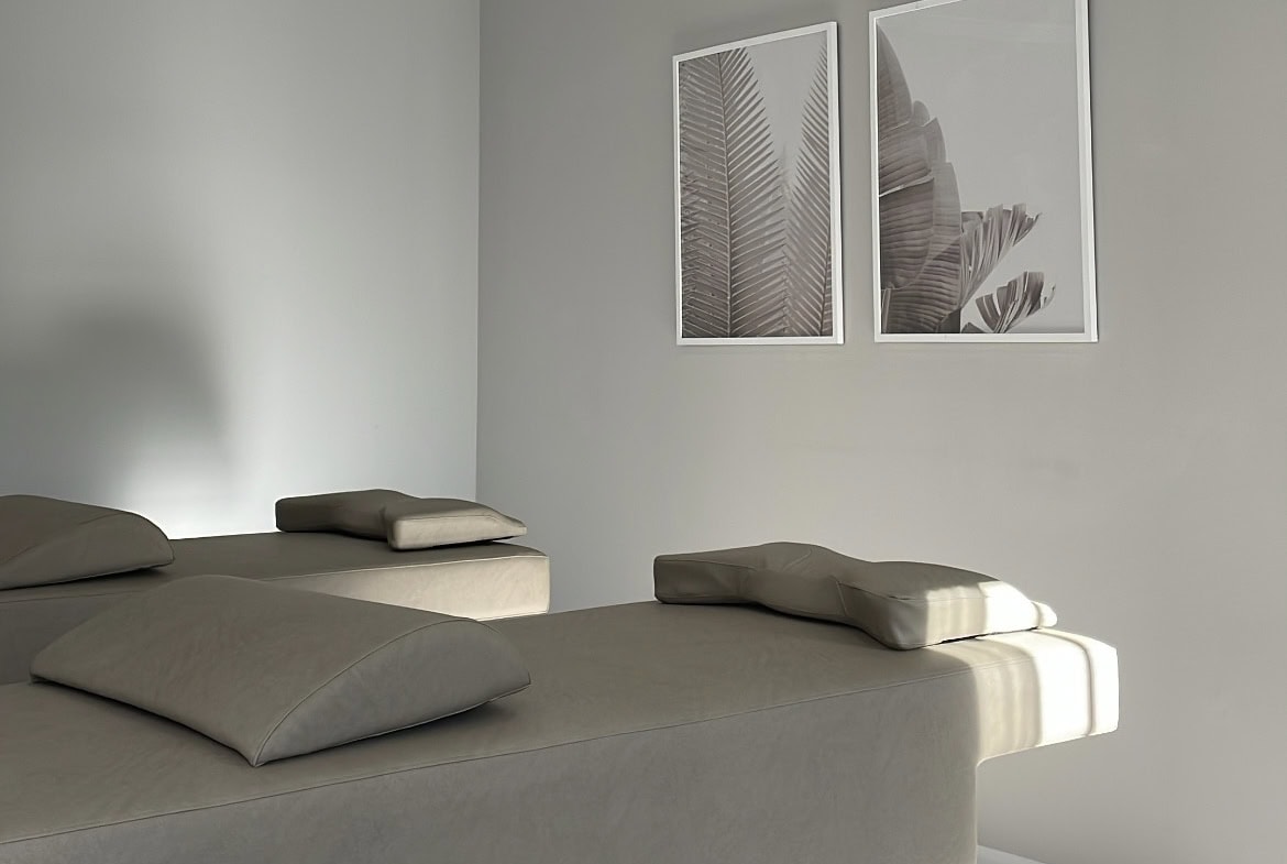 Bright, airy salon rental with stylish decor and comfortable treatment beds.