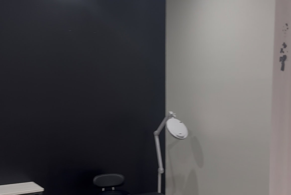 Modern salon treatment room with professional equipment and clean, stylish decor.