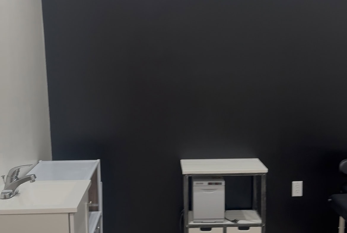 Modern salon workspace with sink and storage, perfect for rent to beauty professionals.