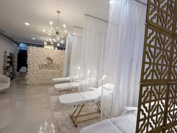 Comfortable salon treatment chairs with elegant white decor, private space, and stylish design for beauty services.