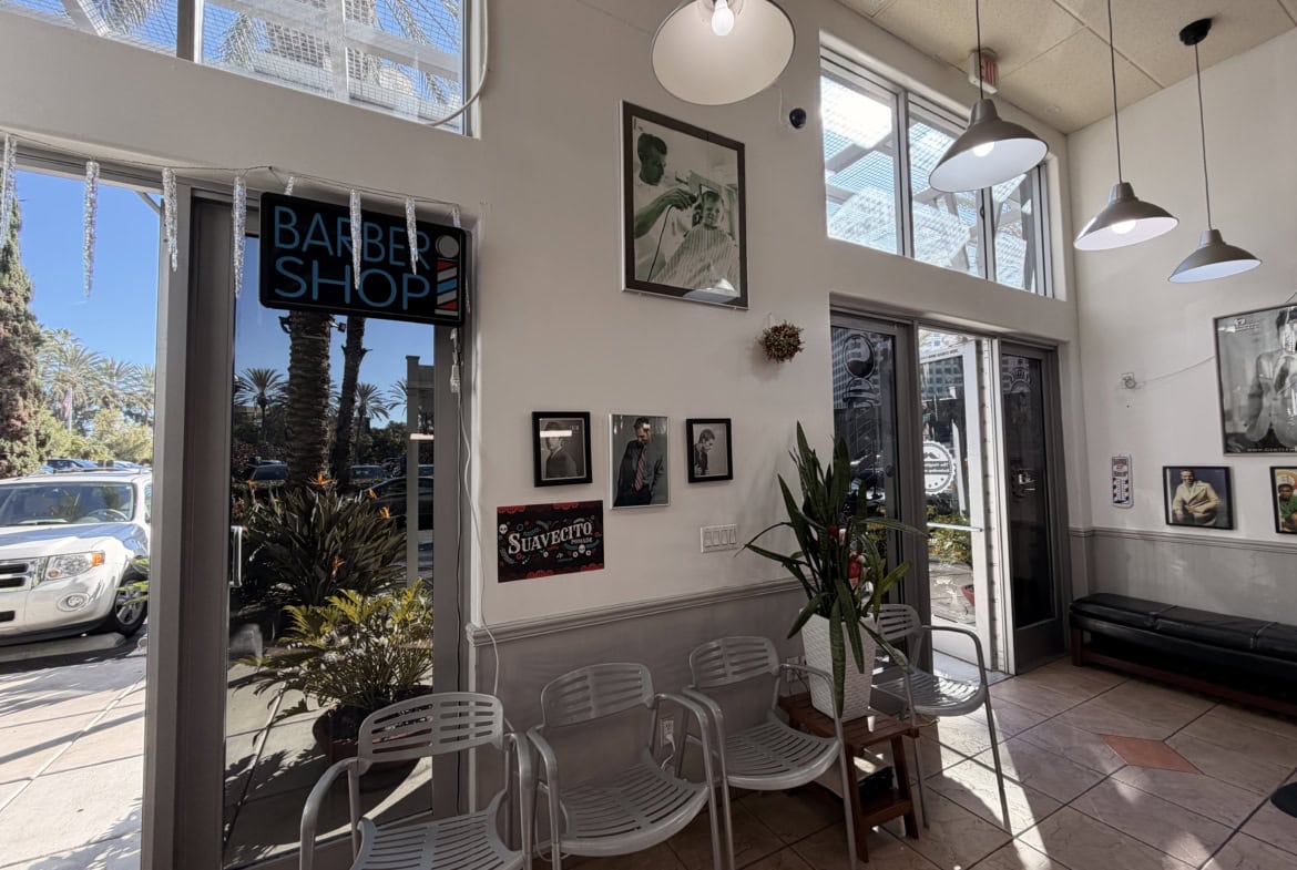 Bright salon interior with comfy seating and trendy artwork.
