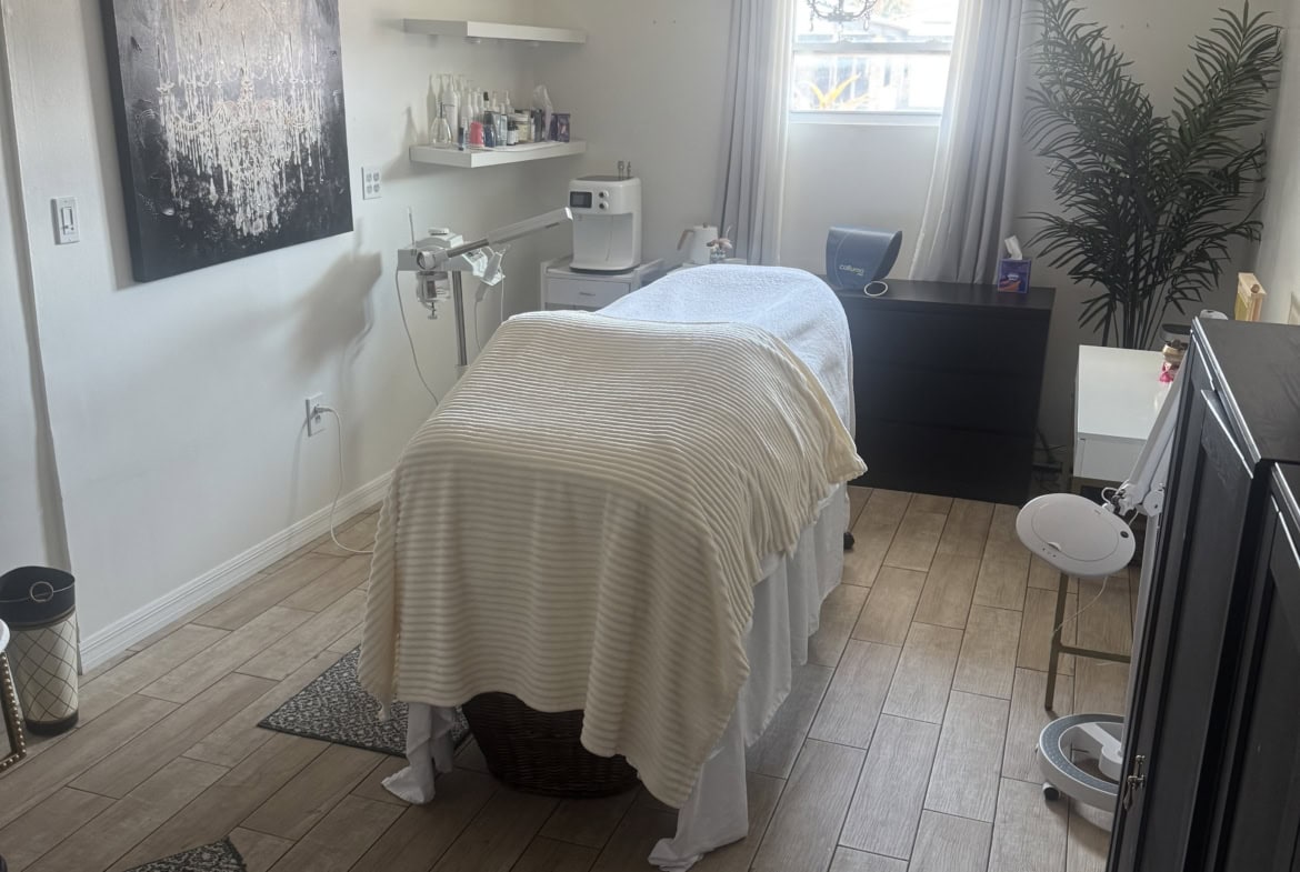 Modern massage therapy room with calming decor and professional spa equipment.