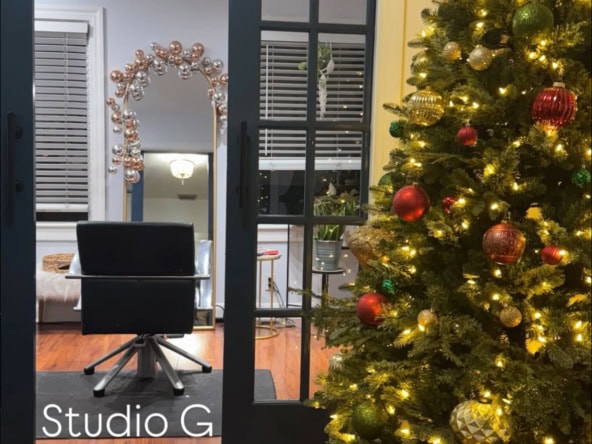 Cozy salon suite with Christmas tree lighting, ideal for beauty professionals and stylists.