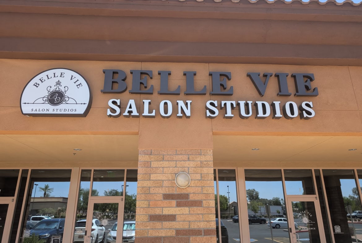 Bright storefront of Belle Vie Salon Studios, showcasing stylish salon rental space and professional branding.