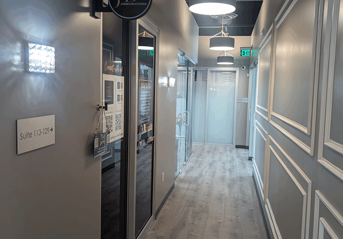 High-quality salon interior featuring modern lighting, clean design, and a welcoming atmosphere.