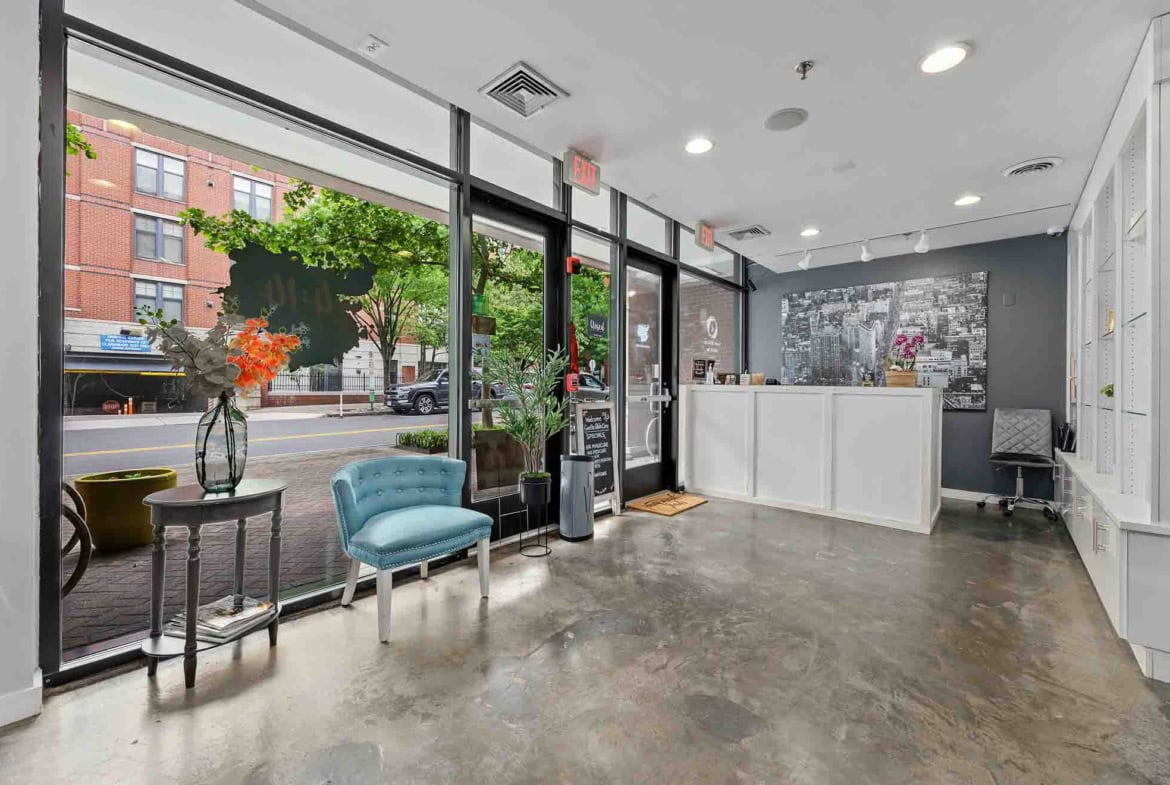 Bright salon interior with welcoming reception and seating for clients, ideal for salon rental.