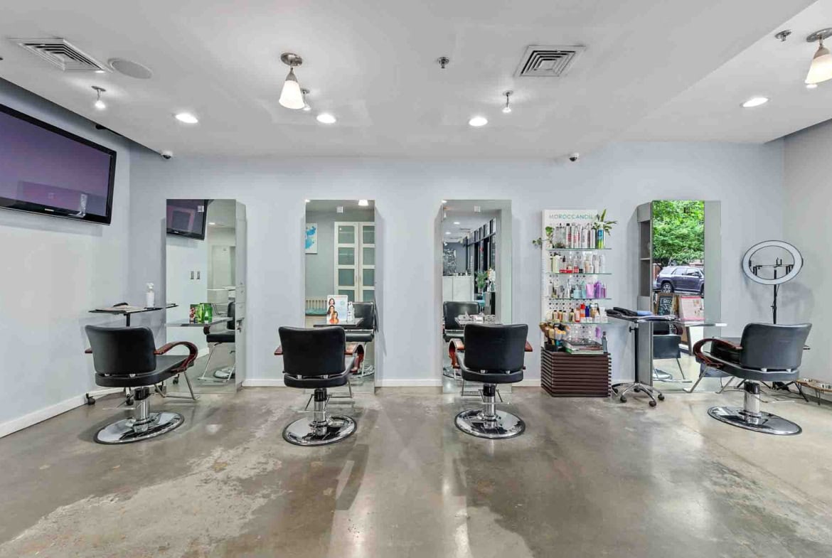 Salon renter workspace with styling chairs, mirrors, and supplies for rent.
