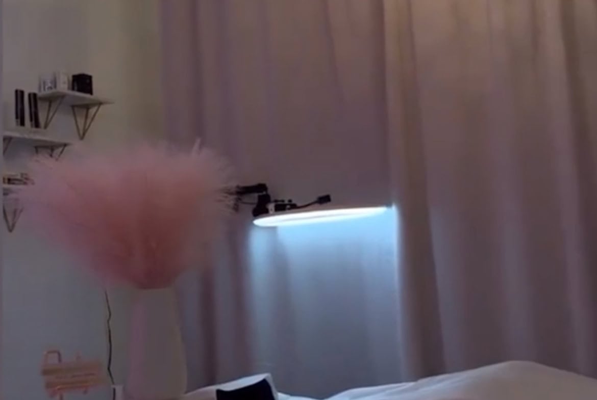 Chic salon interior with elegant chandelier, soft lighting, cozy atmosphere, perfect for hair and beauty services.