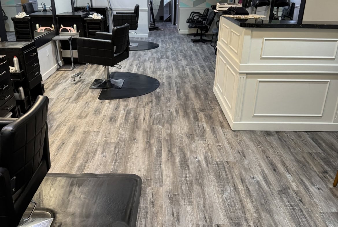Stylish salon interior with modern styling stations and hair drying area for rent.