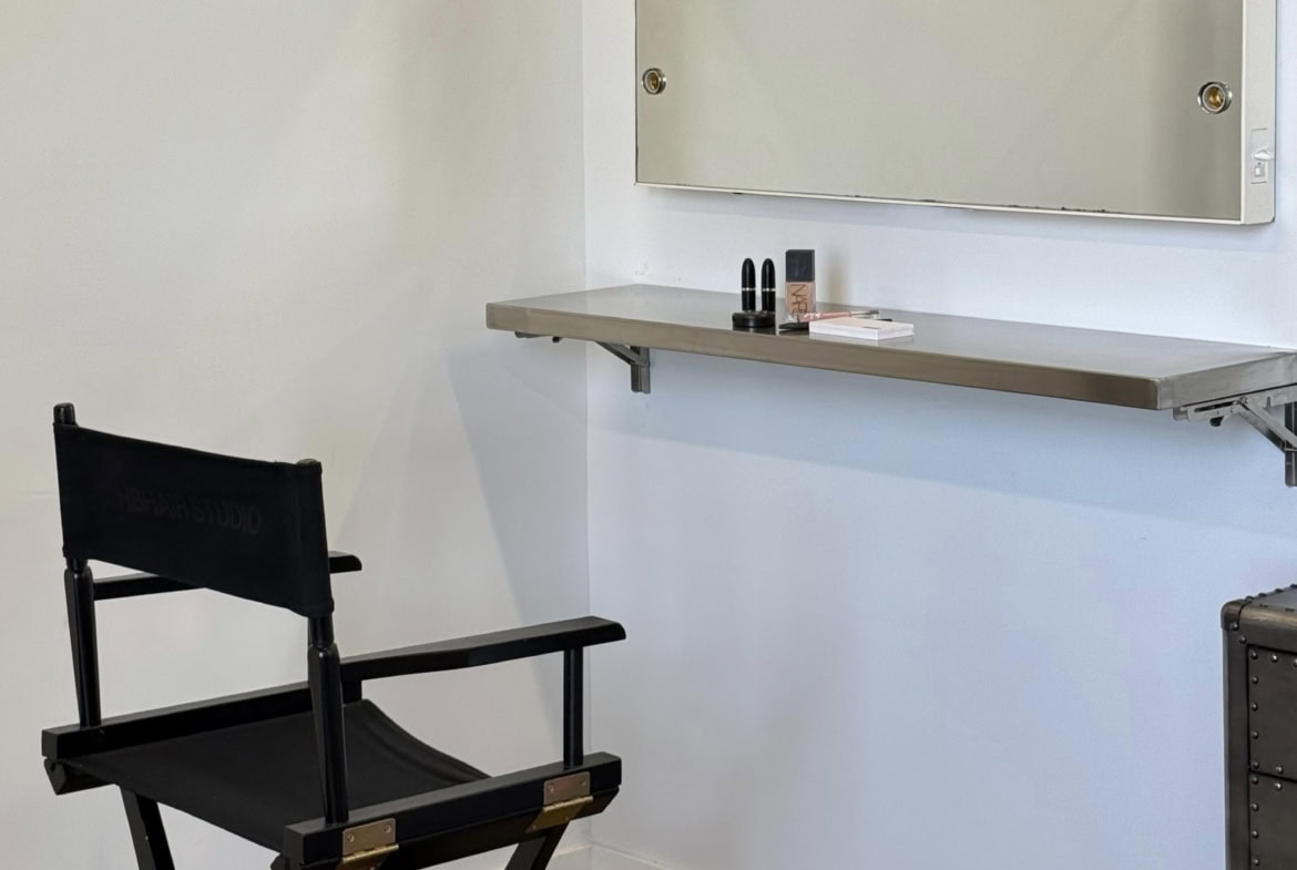 Remote makeup artist mirror with LED lights for salon or studio setup.