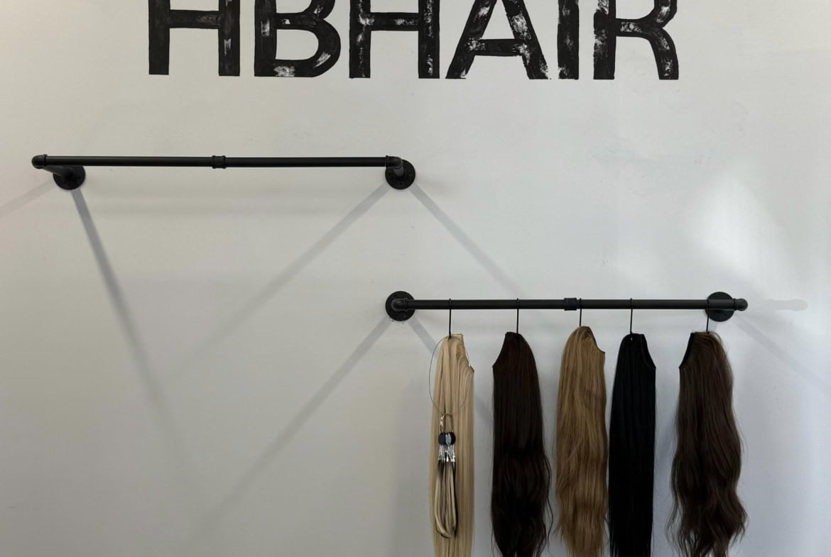 Vibrant hair extension display at Salon Renter, showcasing a variety of hair colors for rent or styling services.