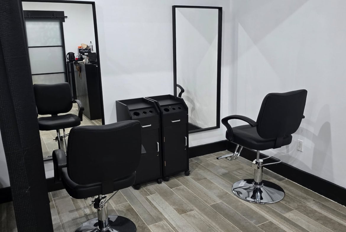 Modern salon styling chairs in a professional hair salon setup.