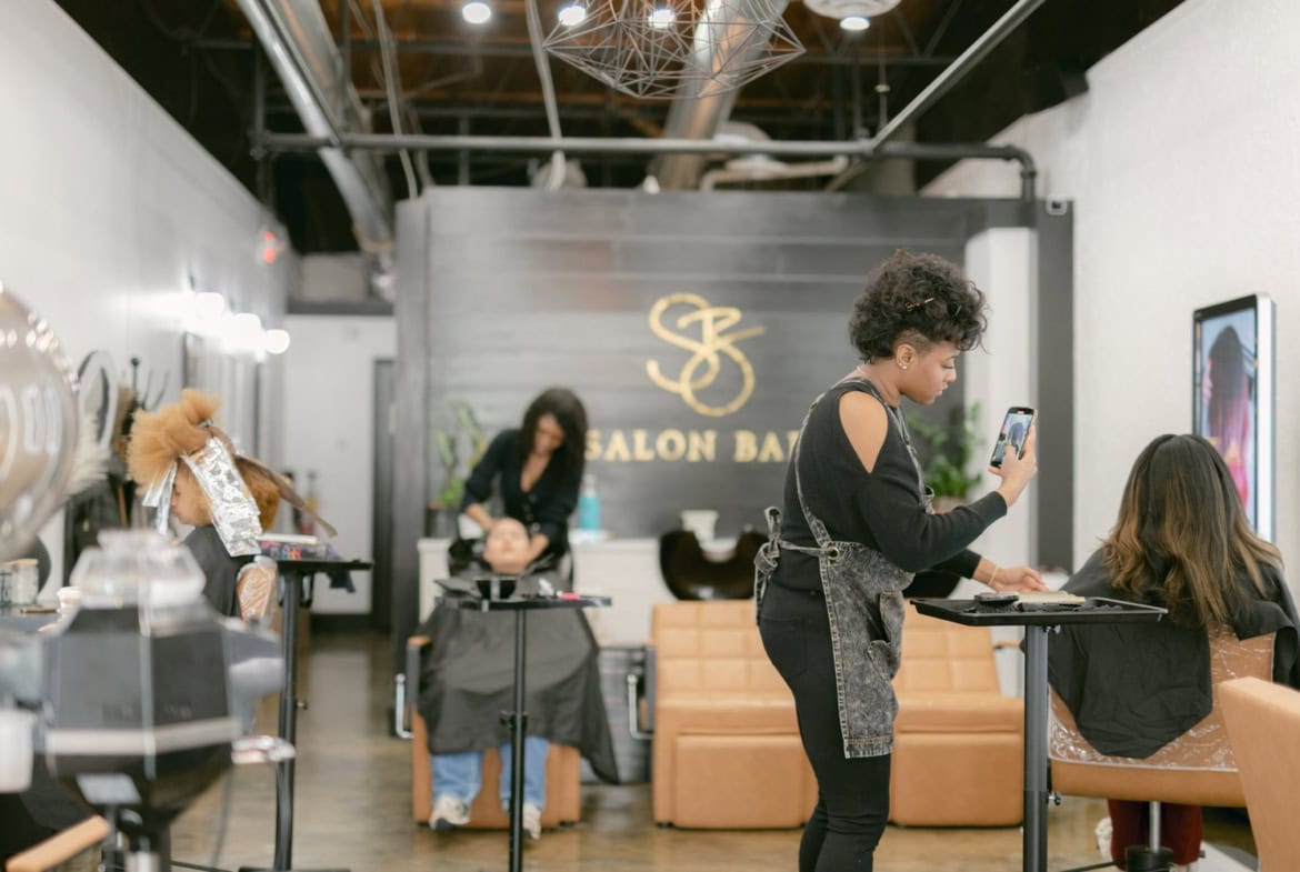 Beautiful salon interior with independent stylists and modern decor in Roswell. Perfect space for pr.