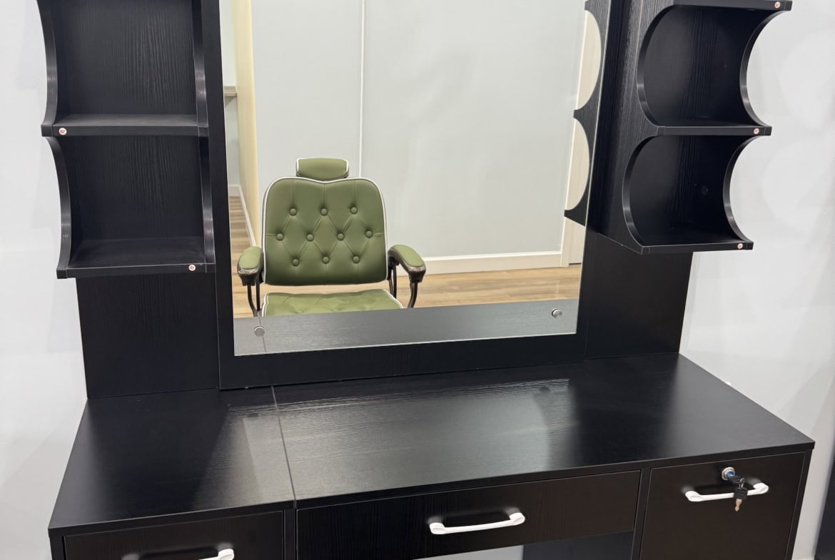 Styling station with mirror and storage shelves for salon professionals. Perfect for hairdressers an.