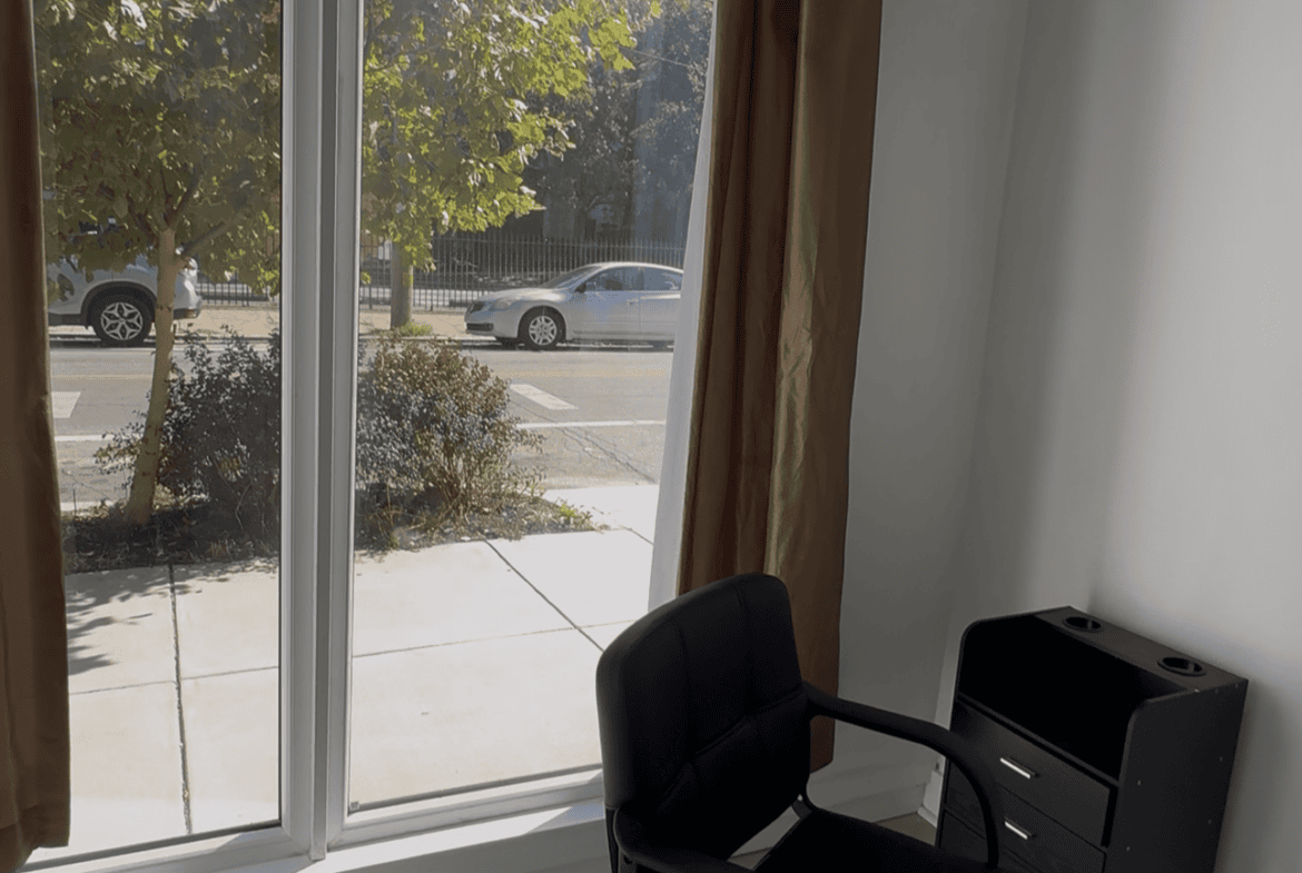 Stylish salon chair by window for haircuts and styling.