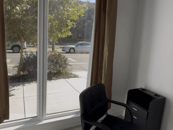 Stylish salon chair by window for haircuts and styling.