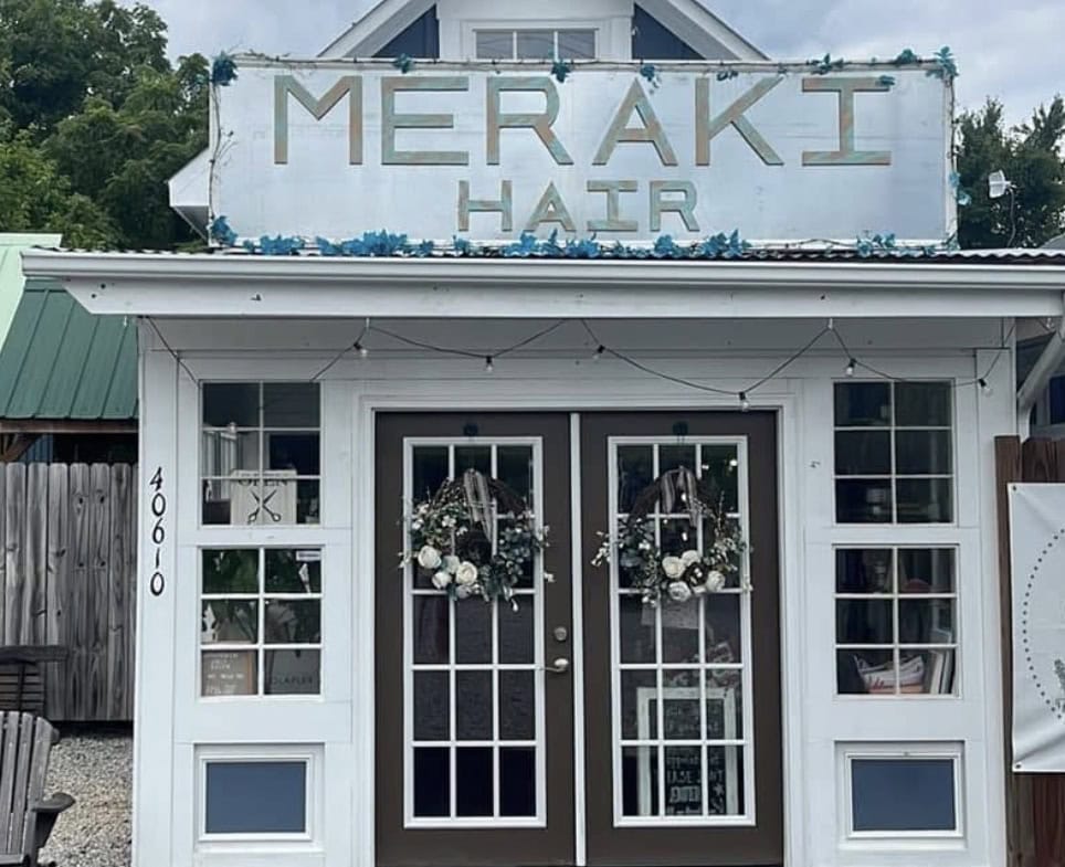 Meraki Hair Salon storefront with welcoming entrance and holiday wreaths.