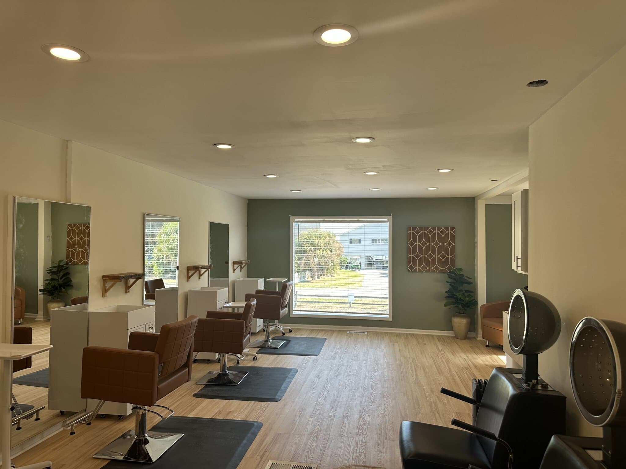 Salon Renter modern salon interior with styling chairs and large window for hair styling services.