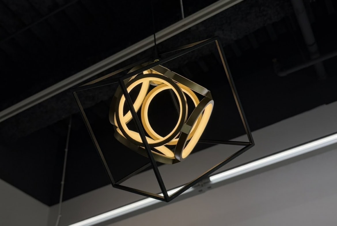 Contemporary geometric pendant light in a salon setting.