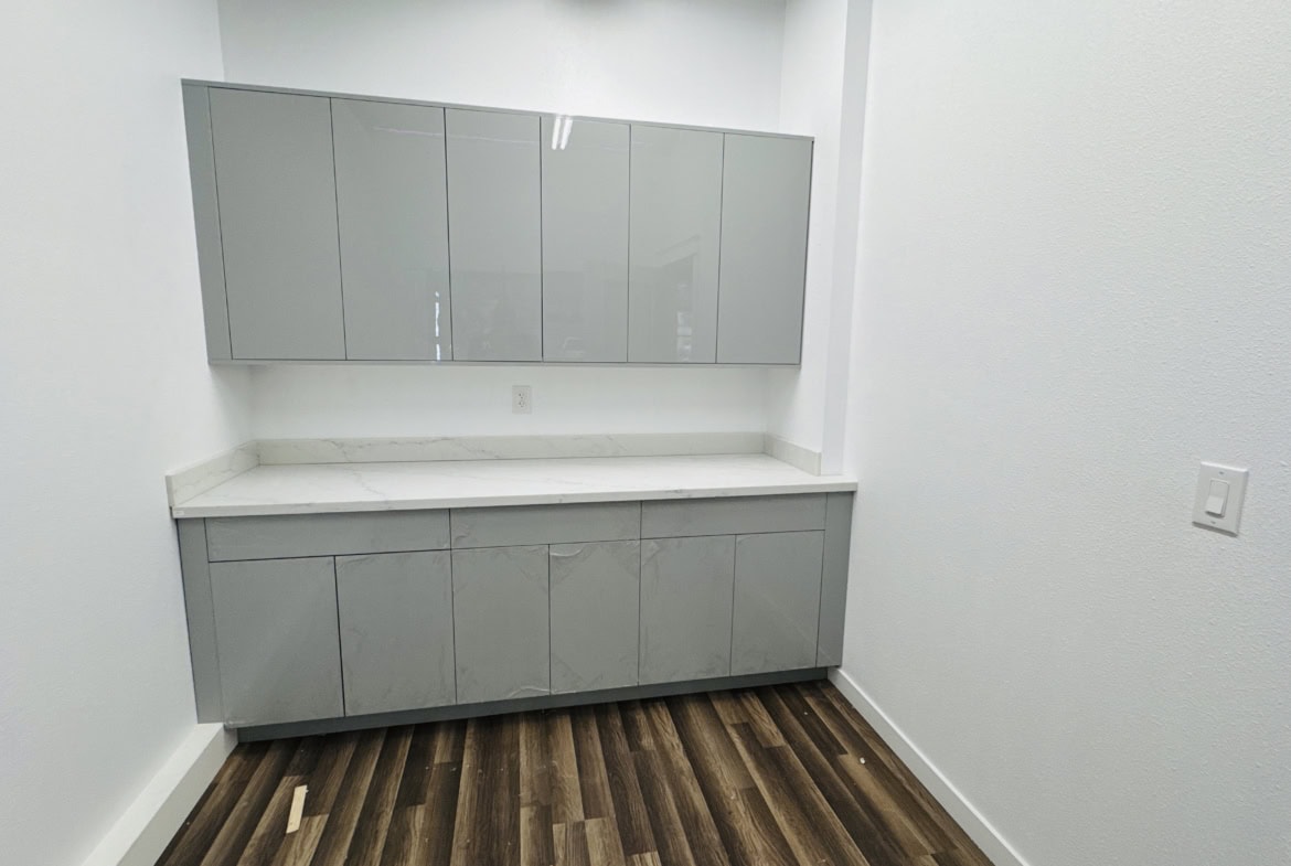 Modern salon storage cabinet with mirror and white countertop for professional hair styling.